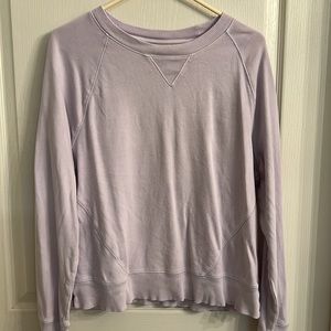 Light purple long sleeved shirt.